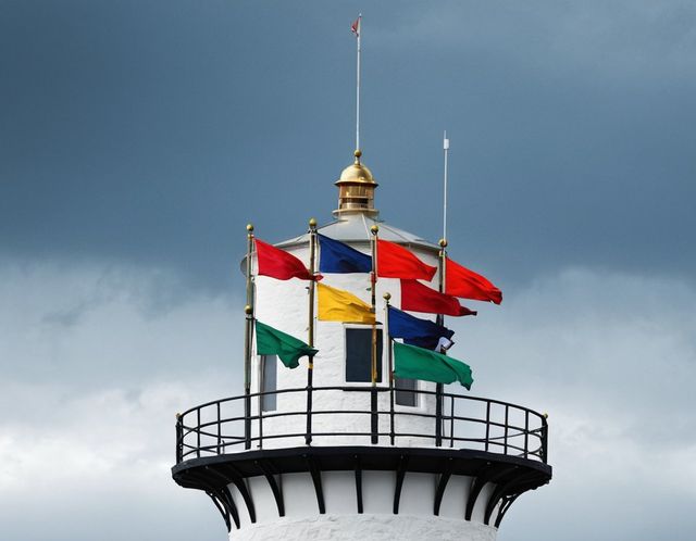 Signal flags on the mast at the top of the lighthouse